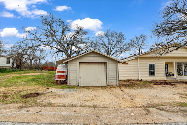 view of shed featuring driveway