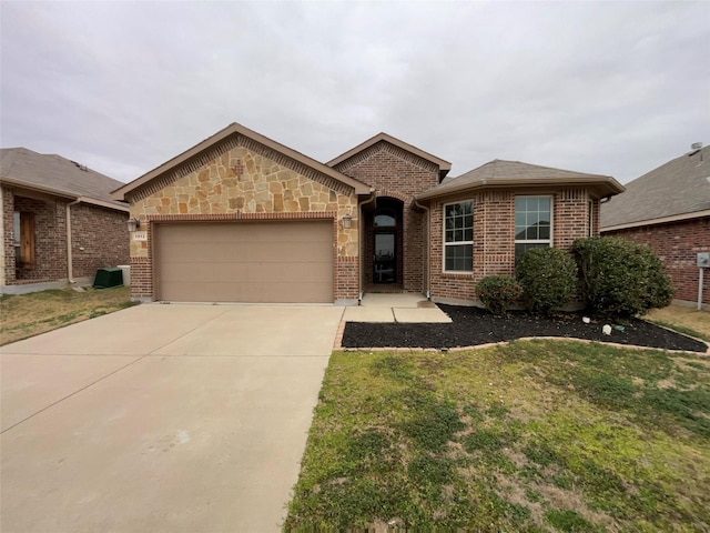 single story home with brick siding, concrete driveway, stone siding, a front yard, and a garage