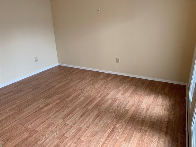 unfurnished room featuring wood-type flooring