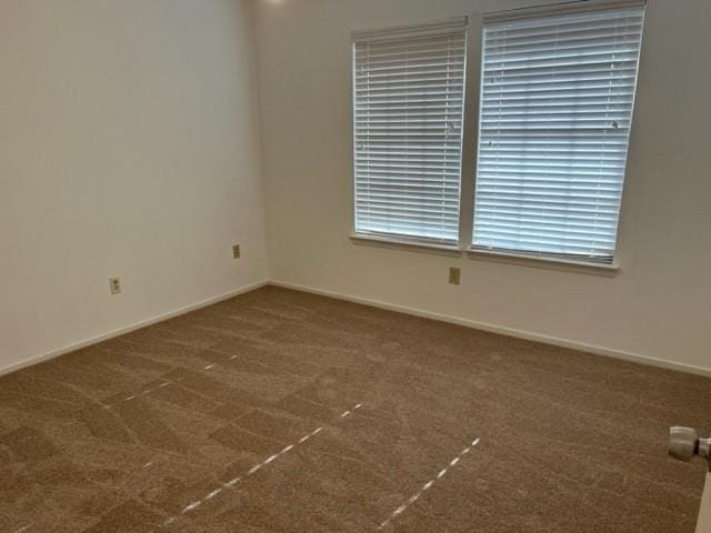 empty room with dark carpet