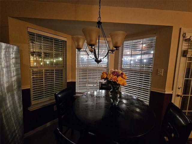 dining space featuring an inviting chandelier