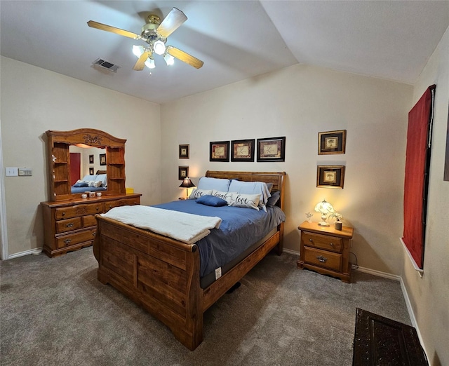 bedroom with dark carpet, vaulted ceiling, and ceiling fan