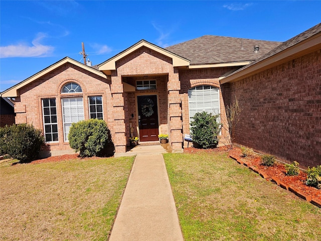 view of front of home with a front lawn