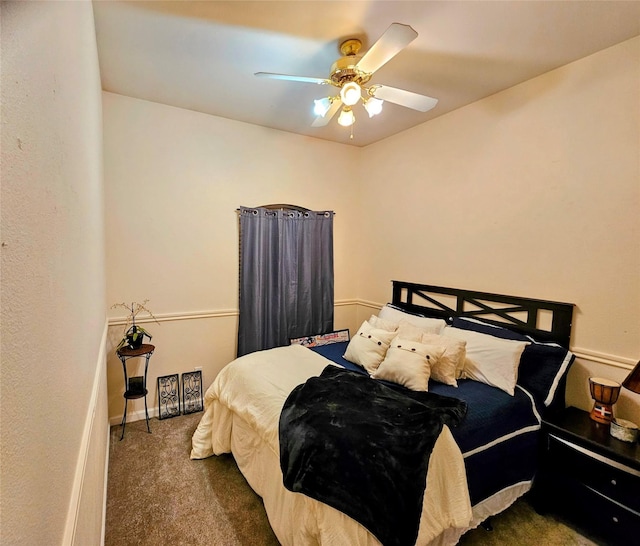 bedroom featuring dark carpet and ceiling fan