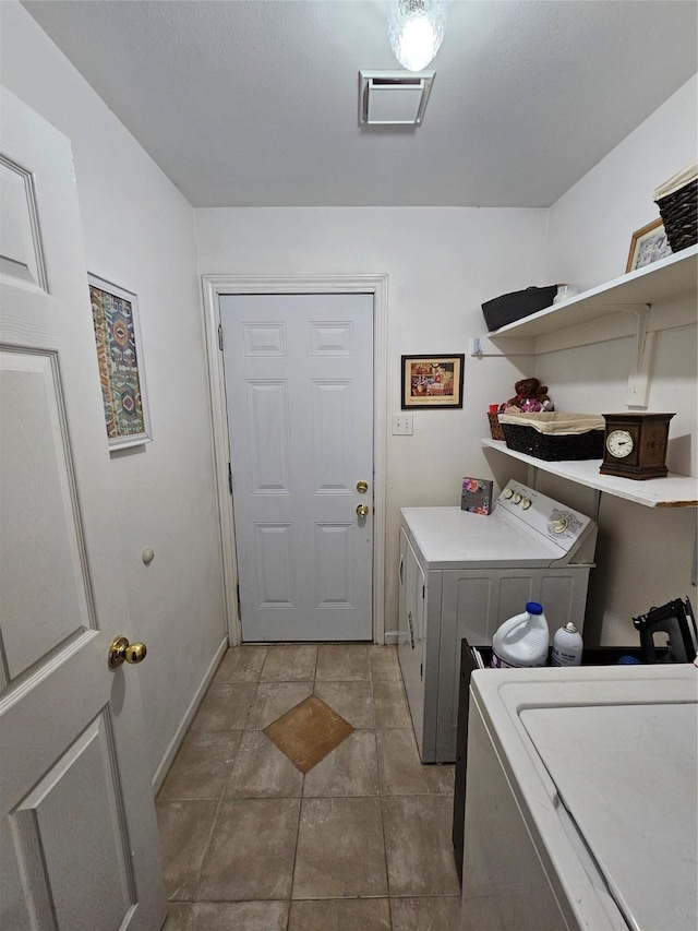 laundry room featuring separate washer and dryer