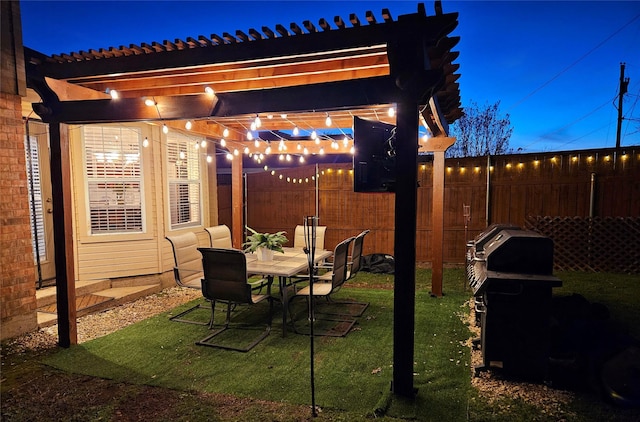 view of patio with grilling area and a pergola