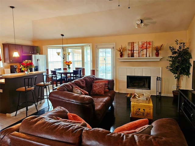 tiled living room featuring a tile fireplace