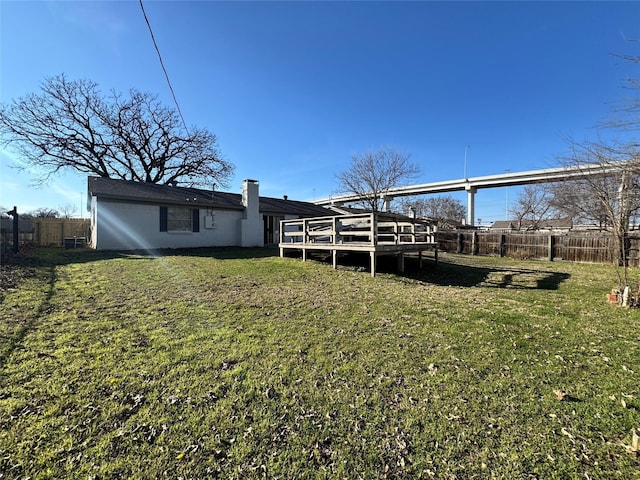 view of yard with a wooden deck