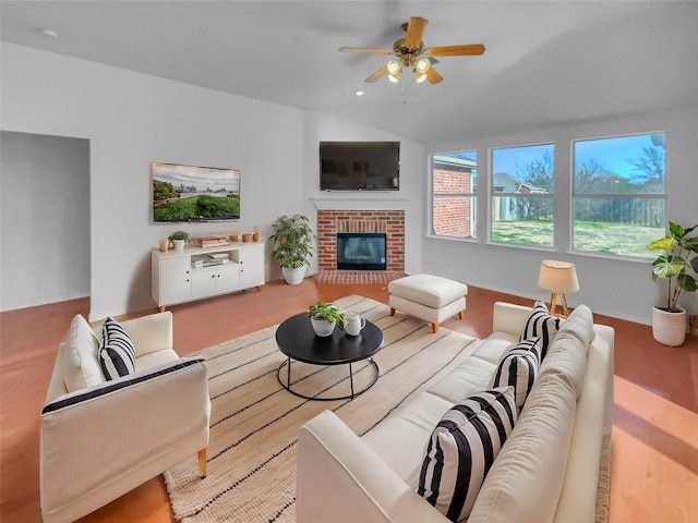 living room with recessed lighting, a brick fireplace, vaulted ceiling, and ceiling fan