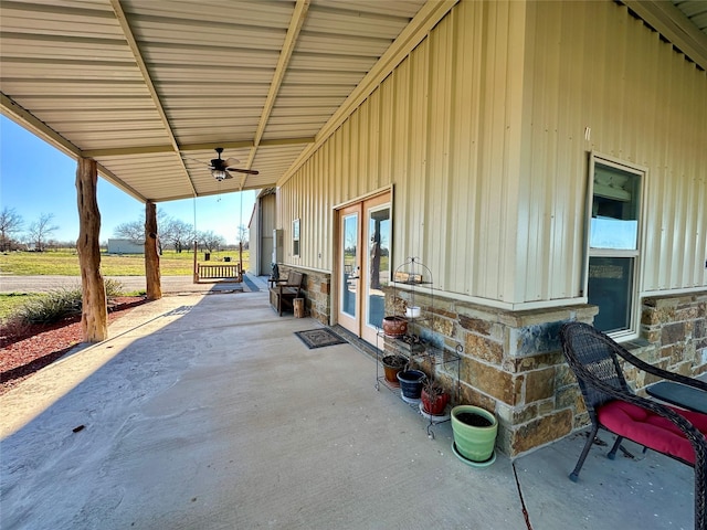 view of patio featuring french doors and ceiling fan