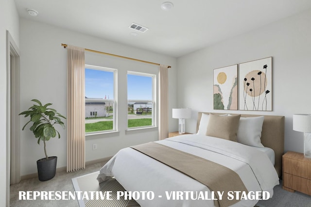 bedroom with light carpet