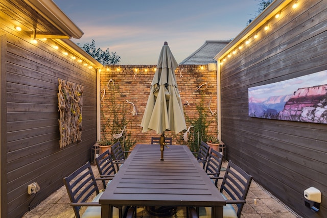 view of patio terrace at dusk