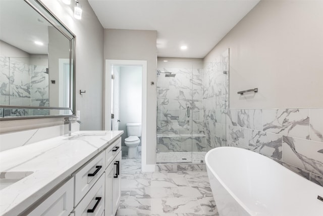 full bathroom featuring independent shower and bath, vanity, and toilet