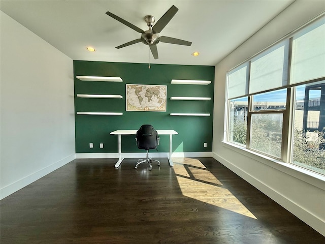 office area with dark wood finished floors and baseboards