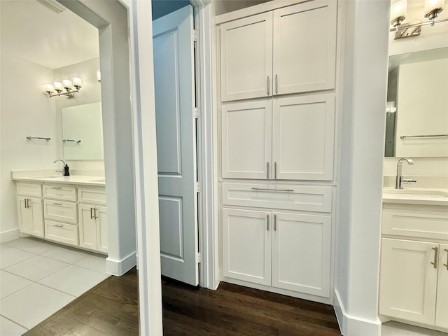 bathroom featuring vanity and wood-type flooring