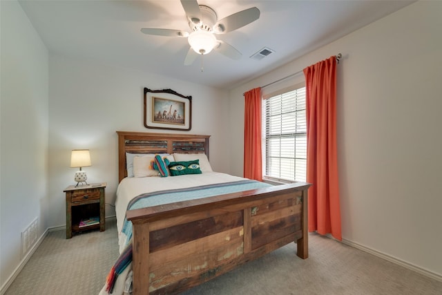 bedroom featuring a ceiling fan, visible vents, and carpet flooring