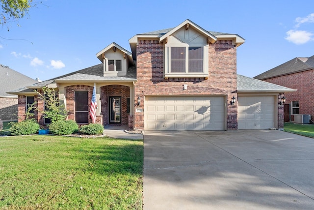 view of front of property with a front lawn, a garage, and cooling unit