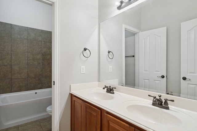 bathroom featuring tile patterned flooring, vanity, toilet, and a bathing tub