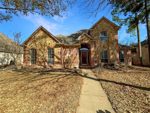 view of front of property featuring stone siding and brick siding