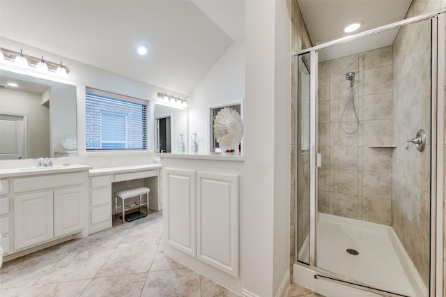 bathroom featuring a stall shower, tile patterned flooring, vaulted ceiling, vanity, and recessed lighting