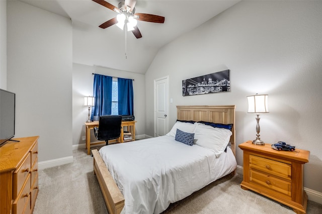 bedroom with a ceiling fan, light carpet, vaulted ceiling, and baseboards