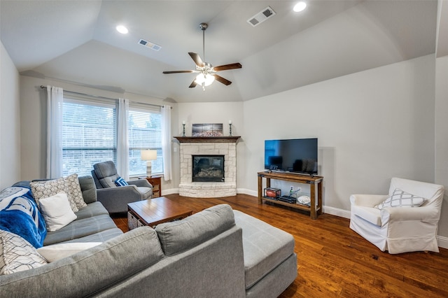 living room with dark wood finished floors, visible vents, vaulted ceiling, and baseboards