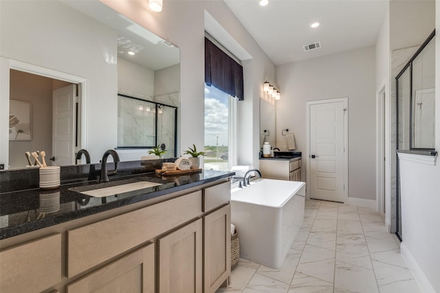 bathroom featuring a stall shower, baseboards, marble finish floor, a freestanding tub, and a sink