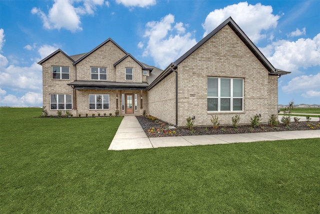 view of front facade featuring a front lawn and brick siding