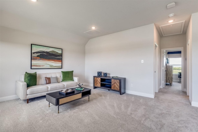 living room featuring carpet, attic access, baseboards, and recessed lighting