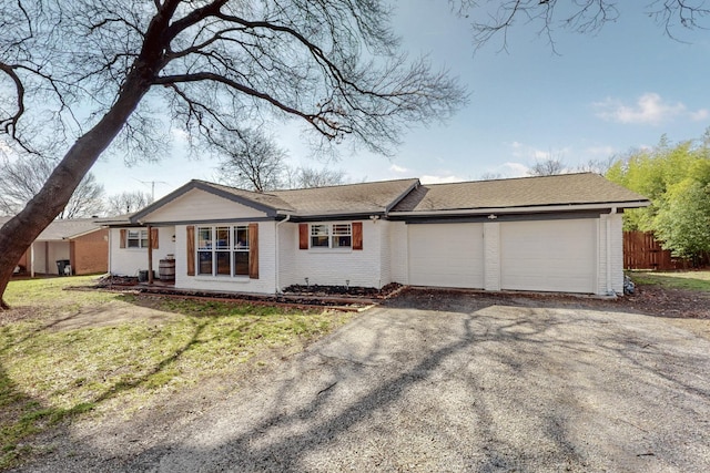 ranch-style house with a front lawn and a garage