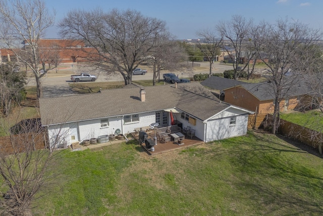 back of property with cooling unit, a yard, and a wooden deck