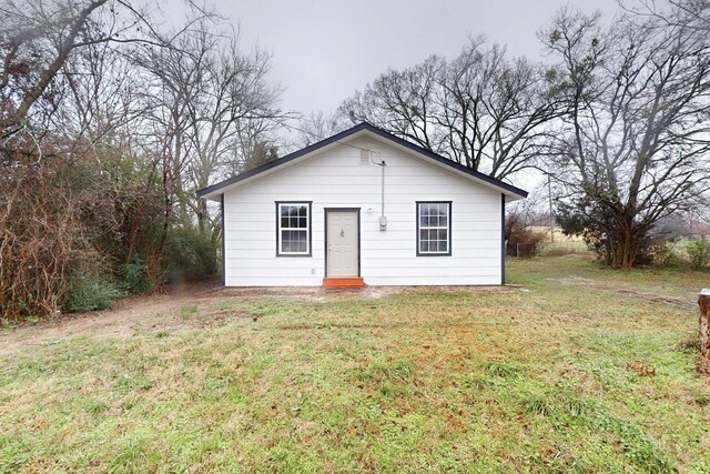 505 Oak St, Commerce, TX 75428 - spare room with baseboards, light wood-type flooring, beamed ceiling, and a ceiling fan