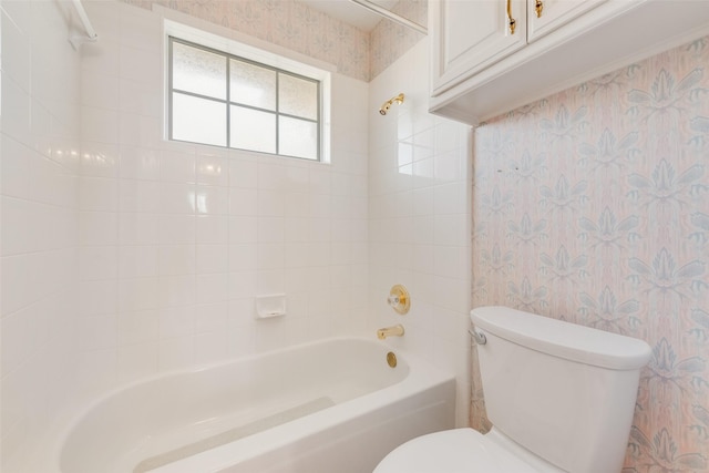 full bath featuring shower / bath combination, toilet, and wallpapered walls