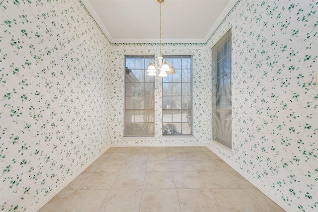 unfurnished dining area featuring a notable chandelier, wallpapered walls, baseboards, and crown molding