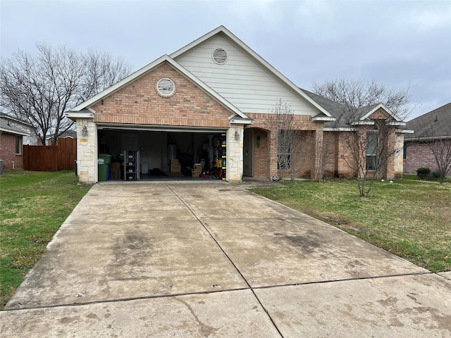 view of front of house featuring a garage and a front yard