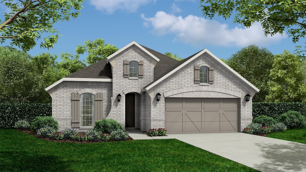 french provincial home featuring a garage and a front yard