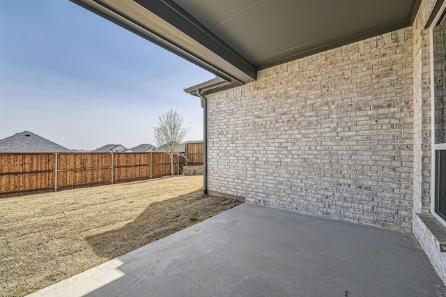 view of patio / terrace featuring fence