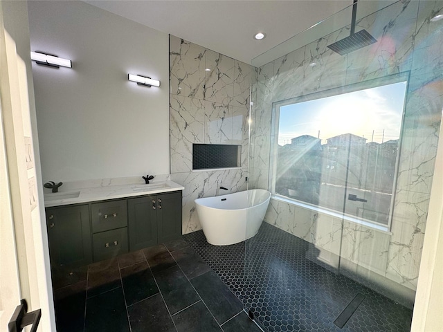 bathroom featuring tile patterned floors, plus walk in shower, tile walls, and vanity