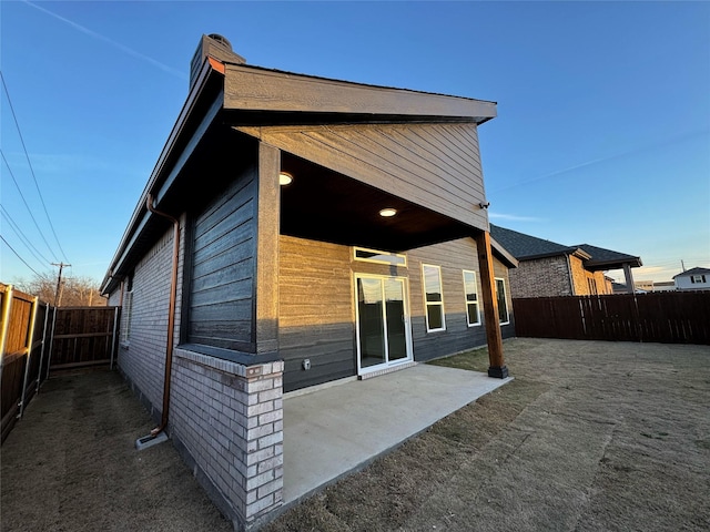 back of property with a patio area