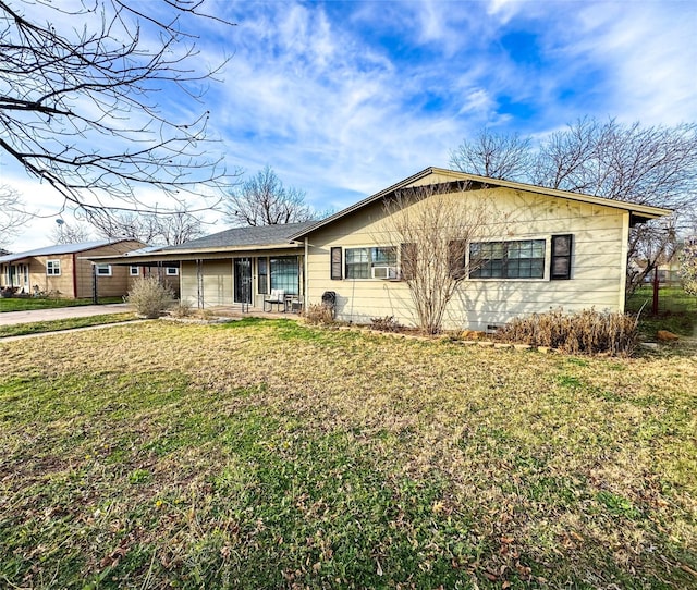 ranch-style home featuring a front yard