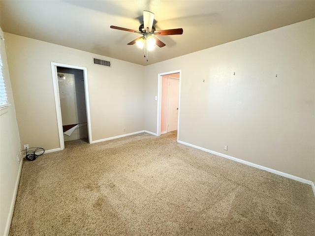 unfurnished bedroom featuring carpet floors and ceiling fan