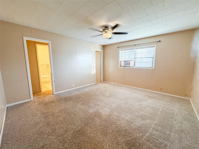 empty room with cooling unit, carpet flooring, and ceiling fan