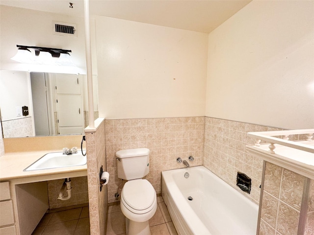 bathroom featuring tile patterned floors, sink, a bathtub, and toilet