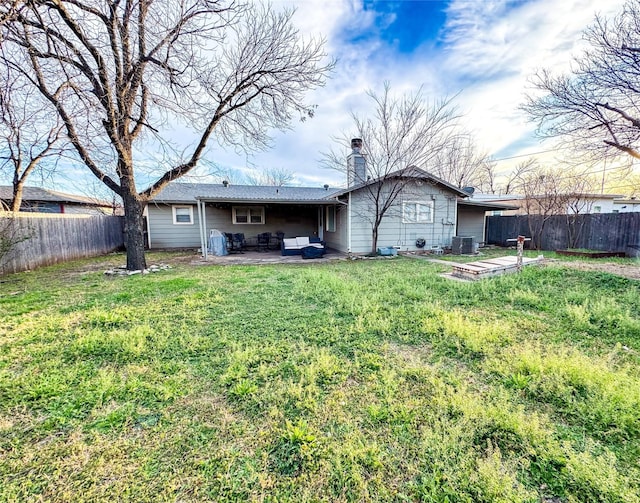back of house with a patio, cooling unit, and a yard