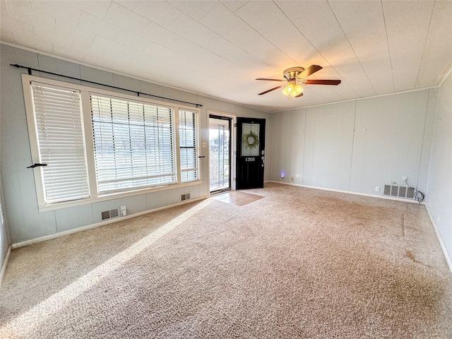 spare room with ceiling fan and carpet flooring