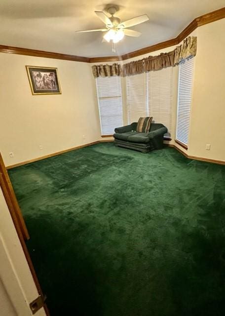 sitting room featuring carpet floors, crown molding, and ceiling fan