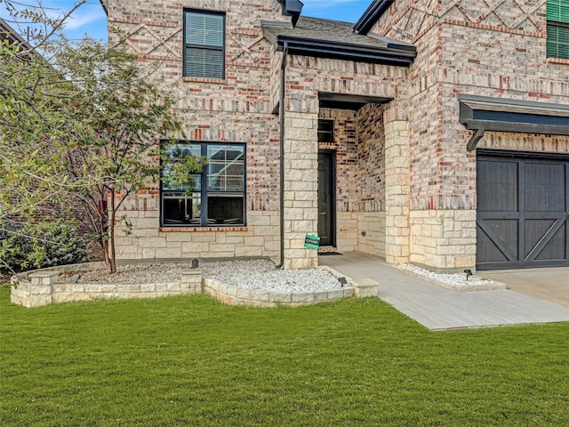 view of exterior entry with a lawn