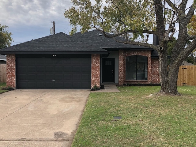 ranch-style home with a front lawn and a garage