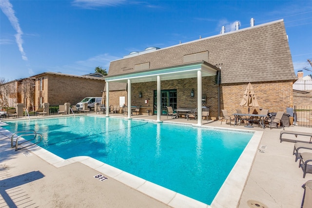 view of pool featuring a patio area