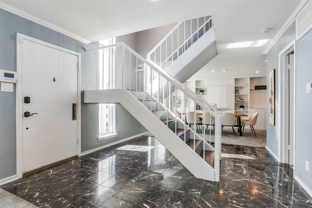 foyer entrance featuring ornamental molding